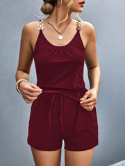 Front view of burgundy romper showing drawstring waist
