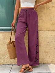 Model wearing plum wide-leg pants, front view