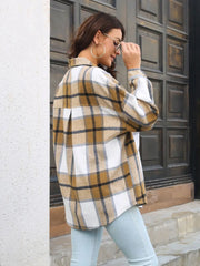 Plaid button-up collared shirt in tan-and-white plaid side view
