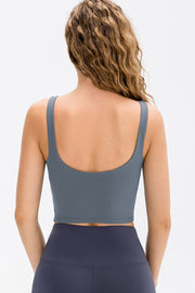 Back view of the slate blue cropped tank top with a low scoop neckline