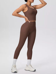 Brown leggings pocket holding a phone, shown with matching tank
