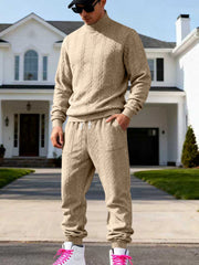Beige cable-knit mock-neck sweater and joggers worn front-facing.