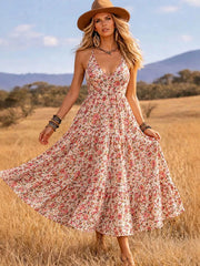Pink floral V-neck midi dress with thin straps and wide tiered skirt, front view