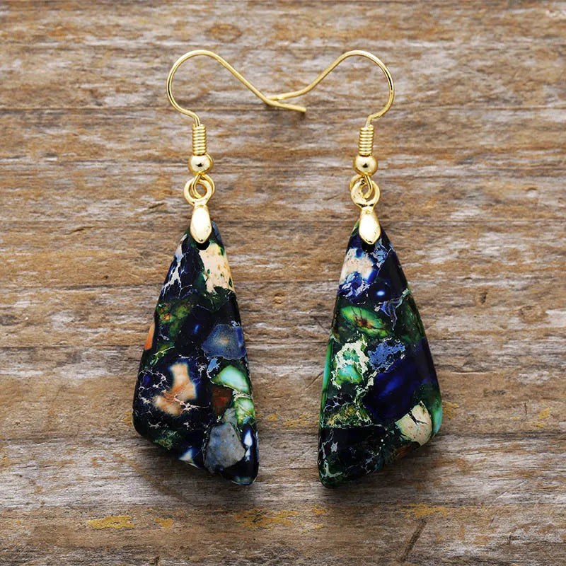 Pair of dark blue, green and cream geometric drop earrings with gold-tone hooks