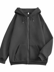 Front view of the charcoal oversized zip-up hoodie with drawstring hood and pockets