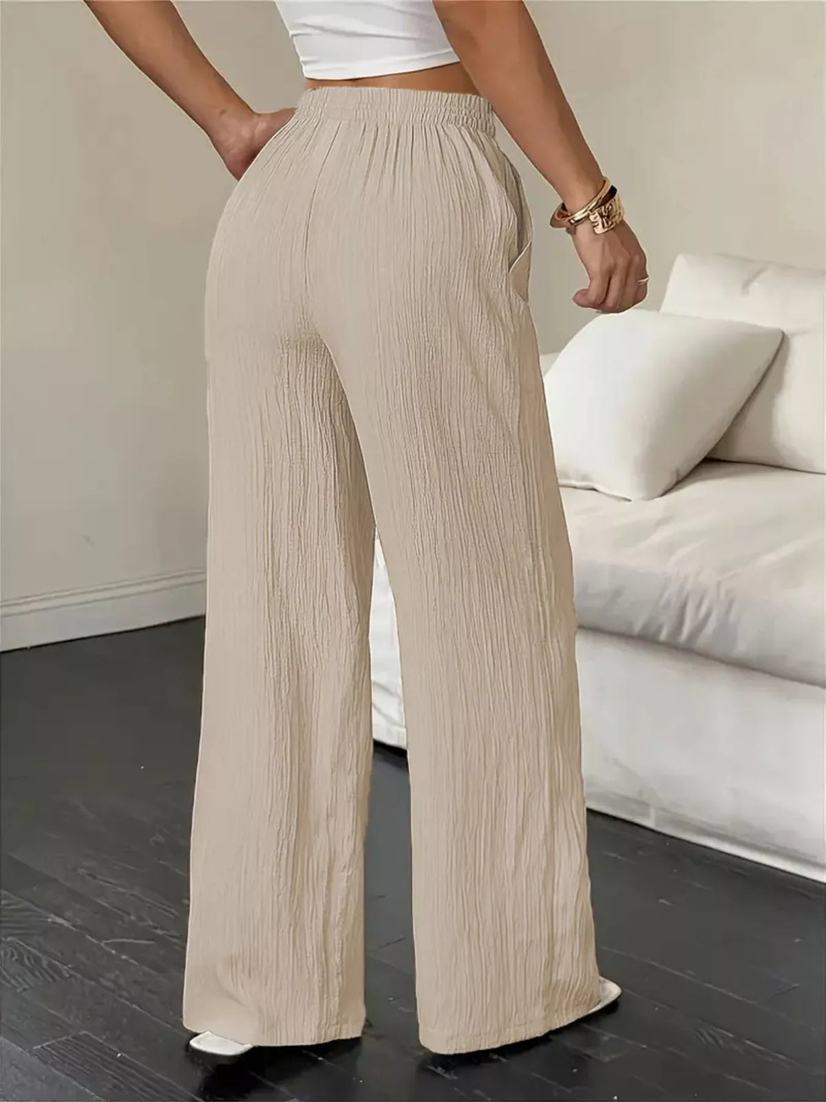 Women's wide-leg pants with drawstring waist and pockets, side view