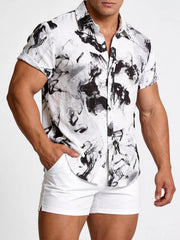 Model wearing a white shirt with black abstract ink-splash print
