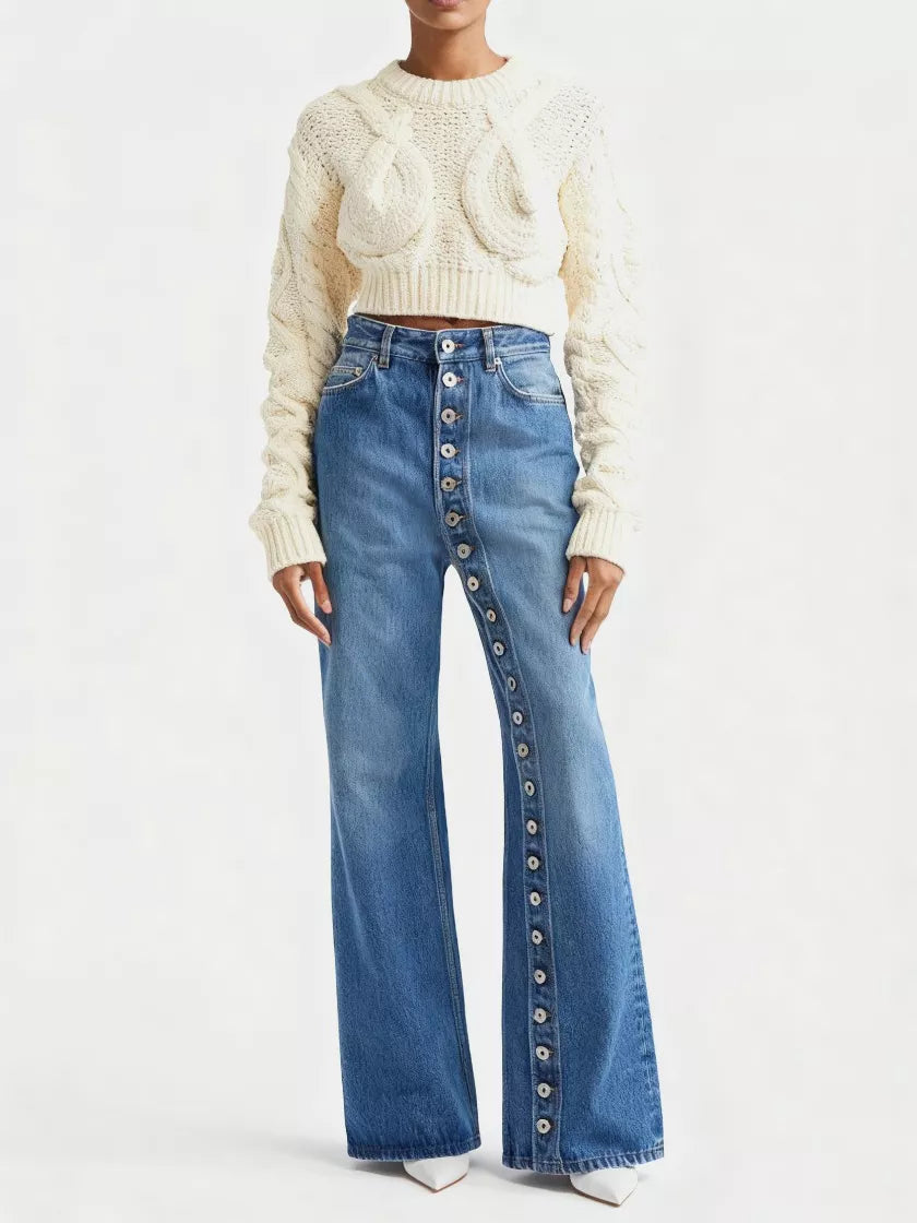 High-waisted blue wide-leg jeans styled with a cropped cable-knit sweater