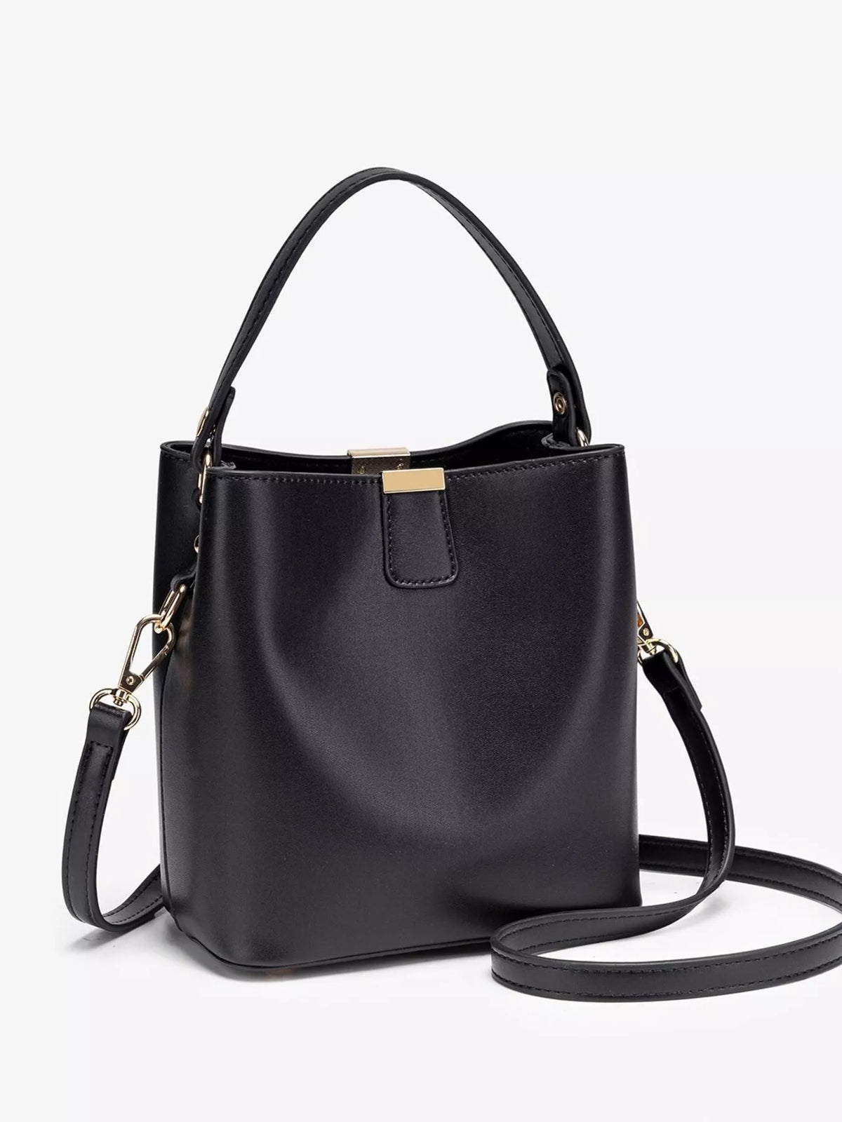 Black bucket crossbody bag shown upright with its long strap extended across a white background.