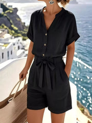 Front view of the black short-sleeve shirt and shorts set with a waist tie.