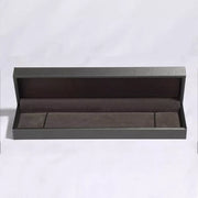 Open dark presentation box for the silver-tone bracelet