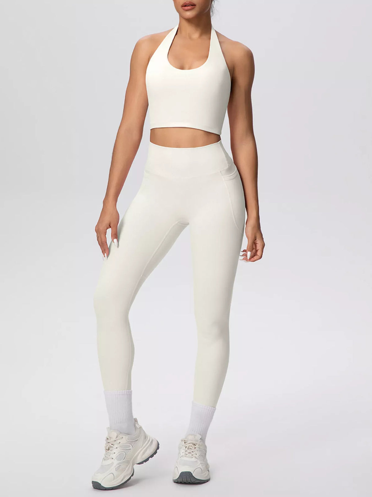 Front view of white halter crop top and leggings