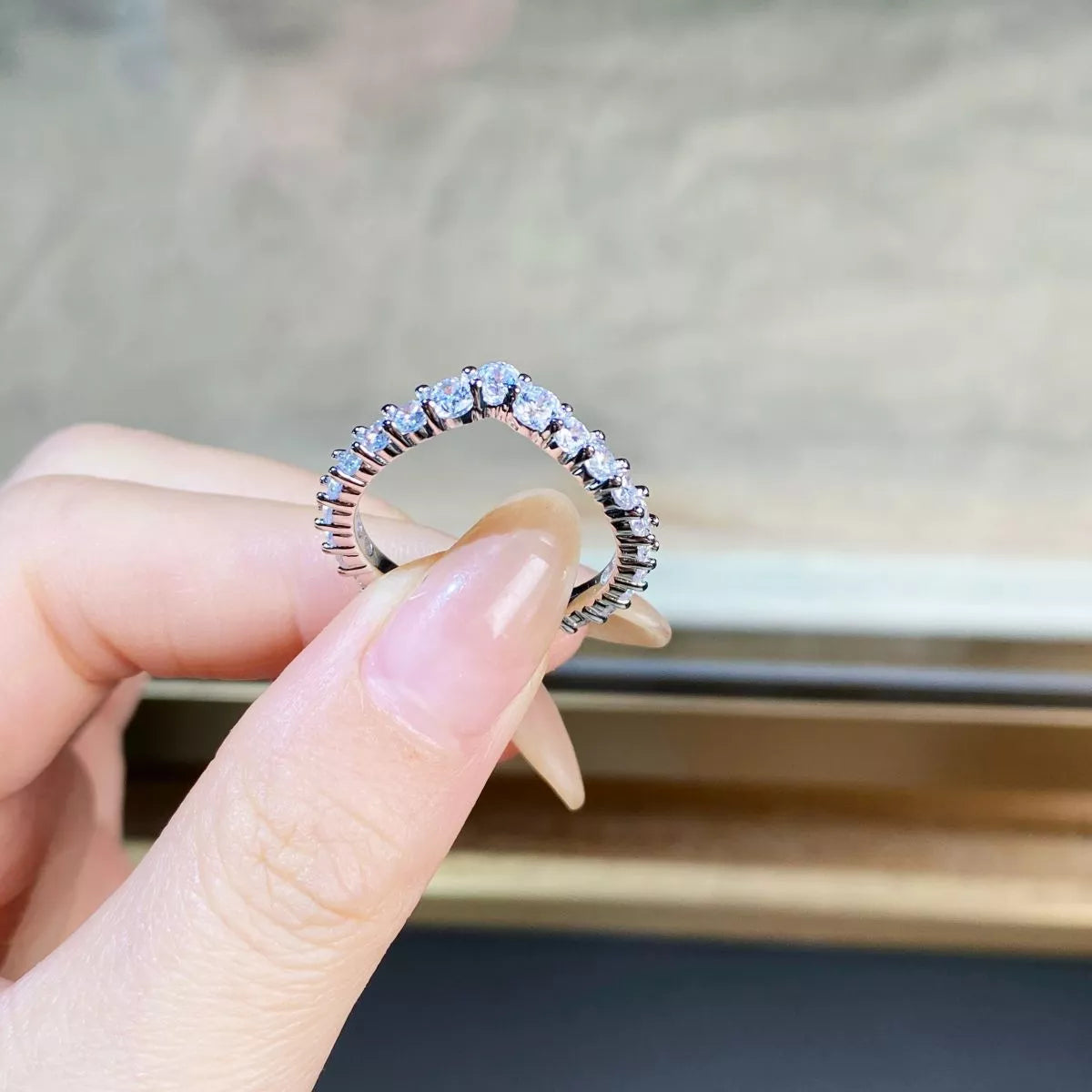 View through the ring showing the inner band and stone settings.