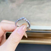 View through the ring showing the inner band and stone settings.