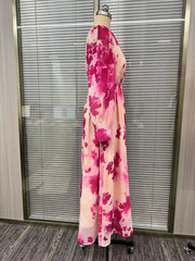 Side view of the pink floral waist-tie maxi dress on a dress form.