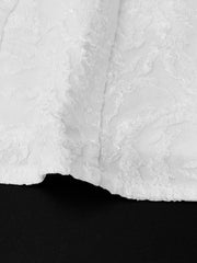 Close-up of skirt seam and textured white fabric