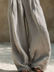 Close-up of gray wide-leg pant legs and soft draped fabric