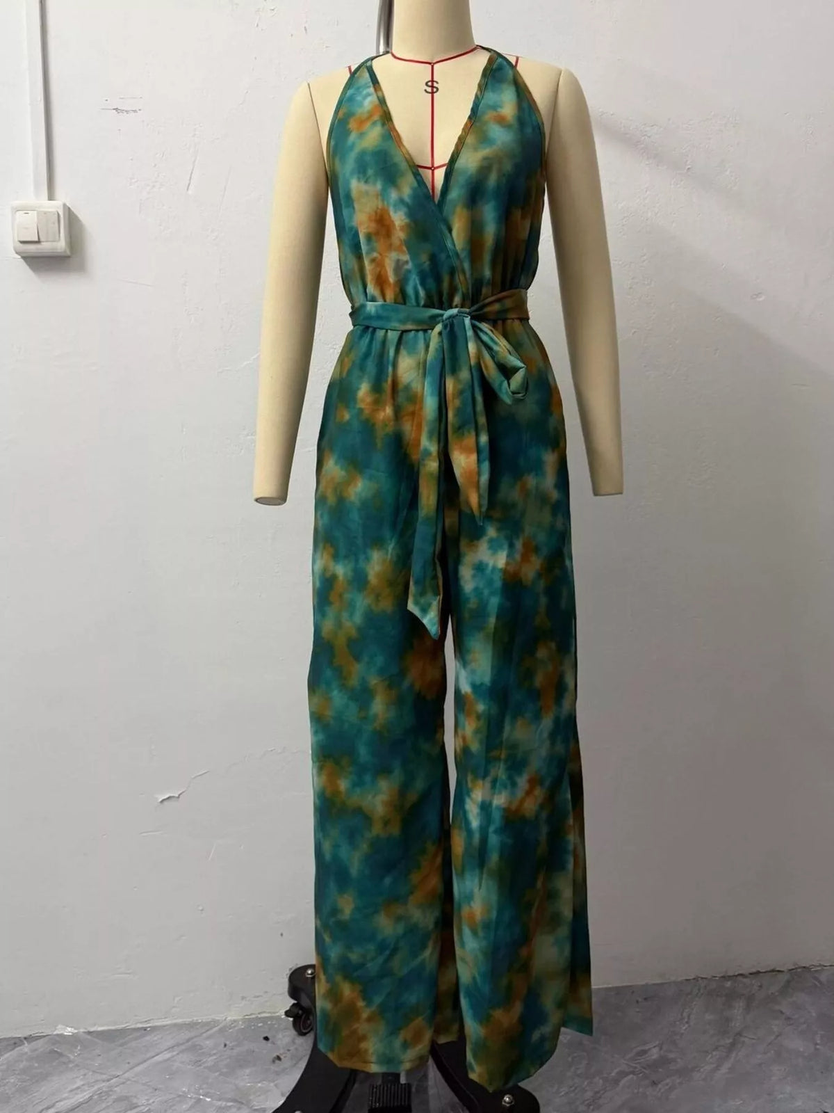 Tie-dye halter jumpsuit displayed on a mannequin from the front
