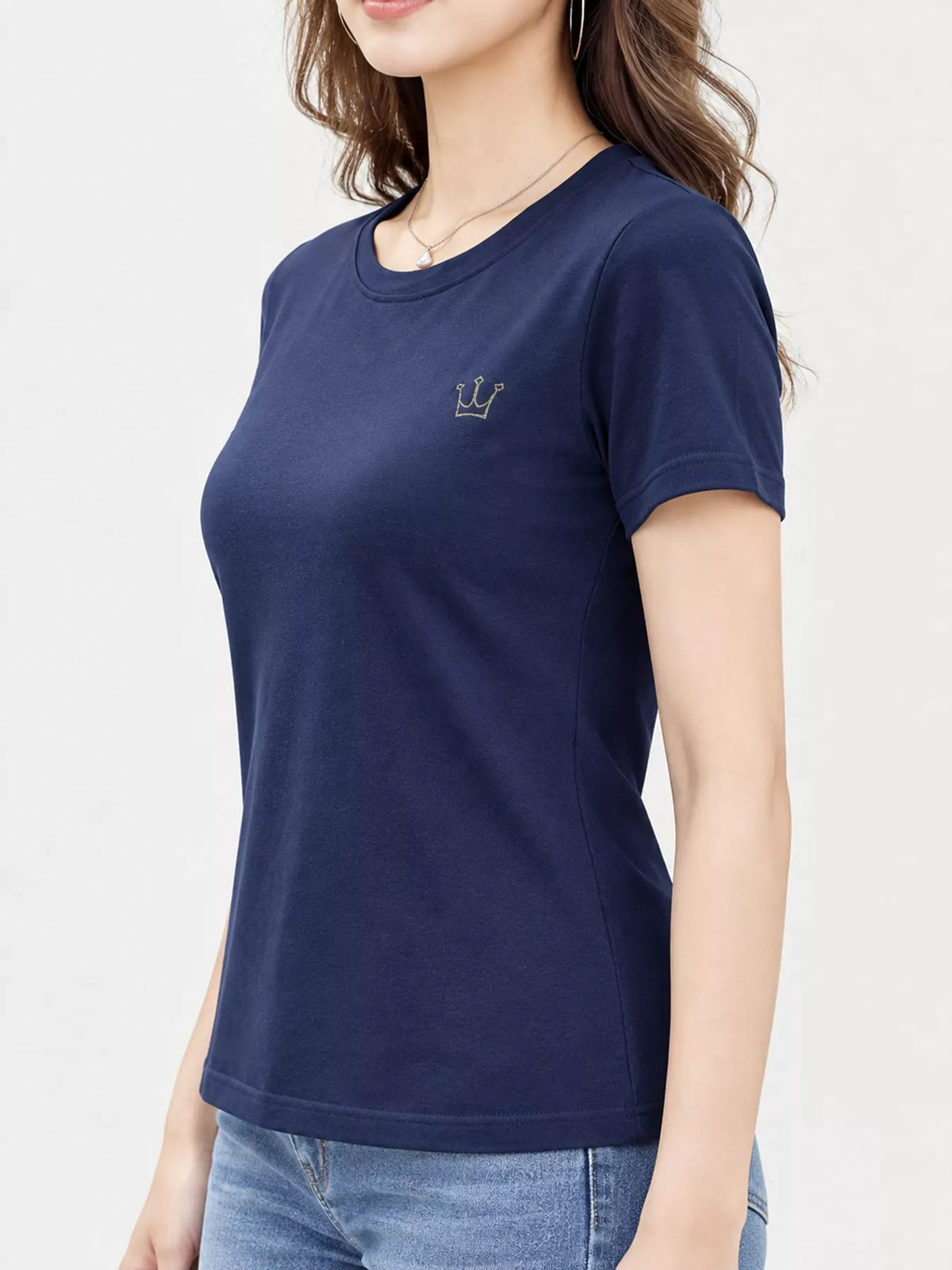 Navy short-sleeve T-shirt with small crown emblem, shown from the front at an angle.
