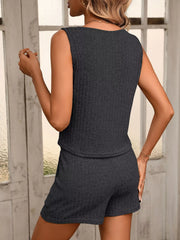 Back view of the charcoal ribbed tank and matching shorts.