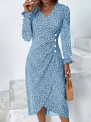 Blue printed surplice midi dress modeled with long sleeves and a wrapped neckline