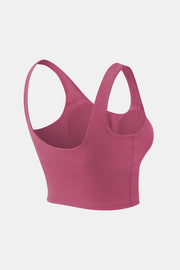 Rose pink cropped tank top viewed from the back at a three-quarter angle