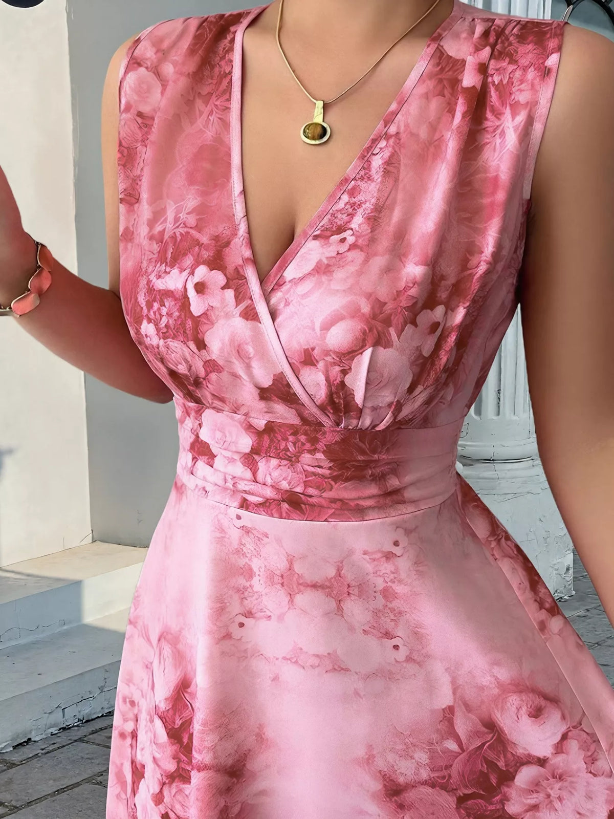 Close view of pink floral print and wrap-style V-neck bodice on maxi dress