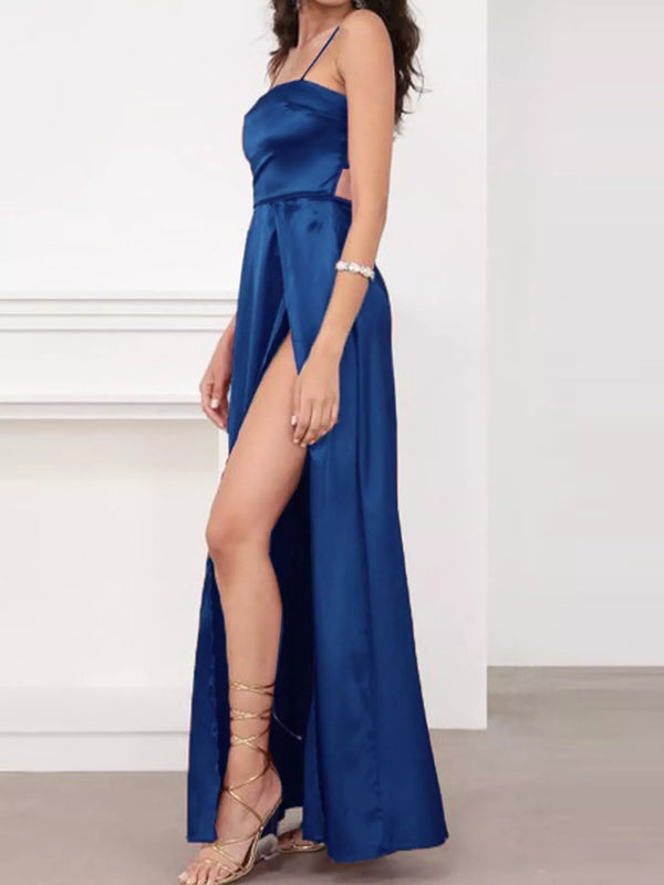 Side view of blue satin-look maxi dress showing its high slit and slim straps