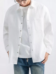 Close front view of shirt collar, buttons, and chest pocket