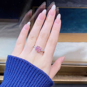 Square pink zircon ring worn on a finger