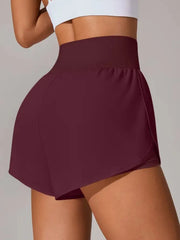 Rear view of burgundy high-waisted shorts with curved outer panel