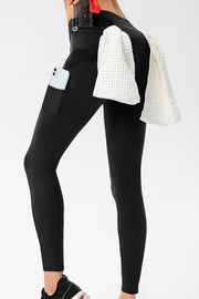 Black high-waist leggings with side pocket and zip pocket detail