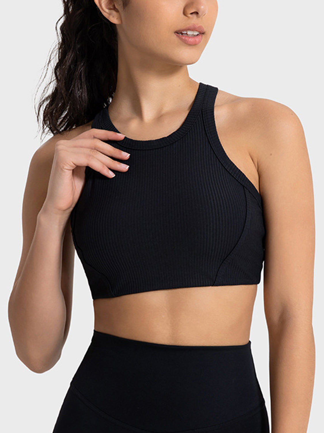 Black cropped sport tank with wide straps, angled front