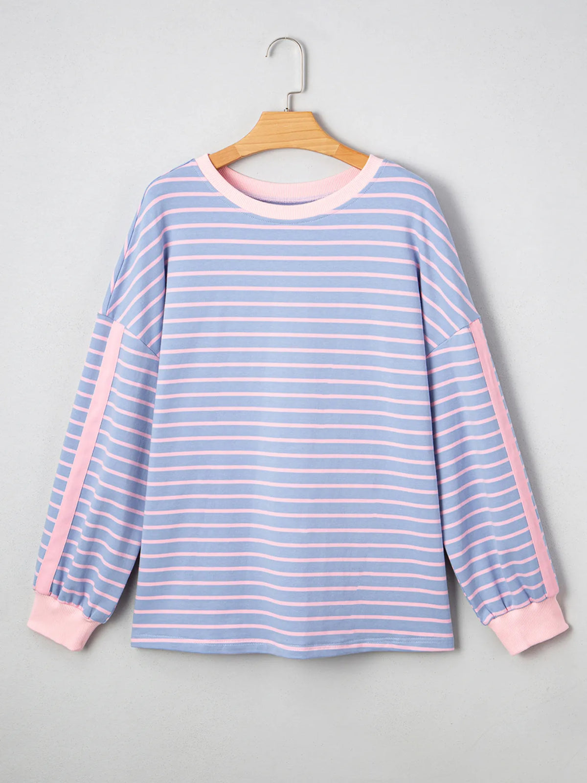 Front product view of blue striped sweatshirt with pink trim