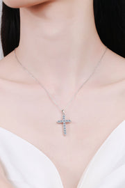 Model wearing a silver-tone moissanite cross necklace