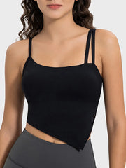 Detail view of peach asymmetrical hem on the active cami