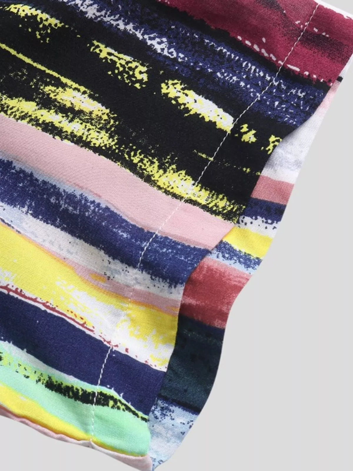 Close-up of navy, pink, yellow and mint stripes on the sleeve