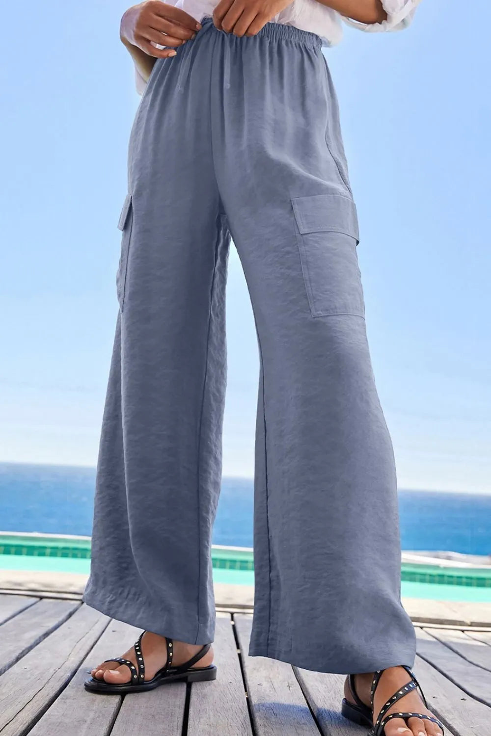 Blue wide-leg utility trousers shown from the front