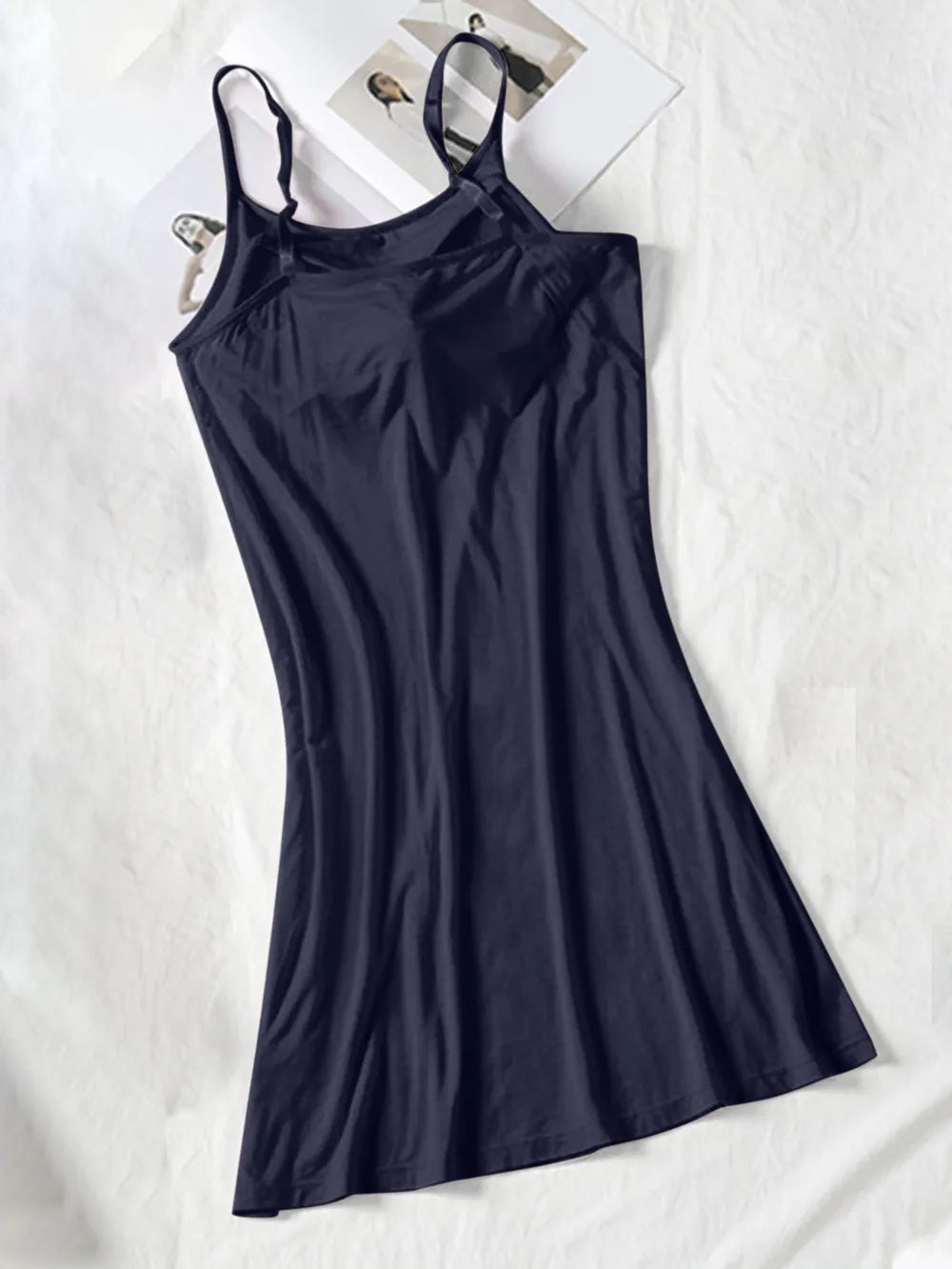 Dark navy spaghetti-strap cami dress shown full length