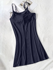 Dark navy spaghetti-strap cami dress shown full length