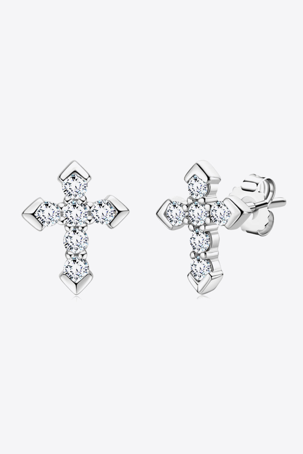 Pair of silver-tone cross stud earrings covered in small clear stones, shown front and side