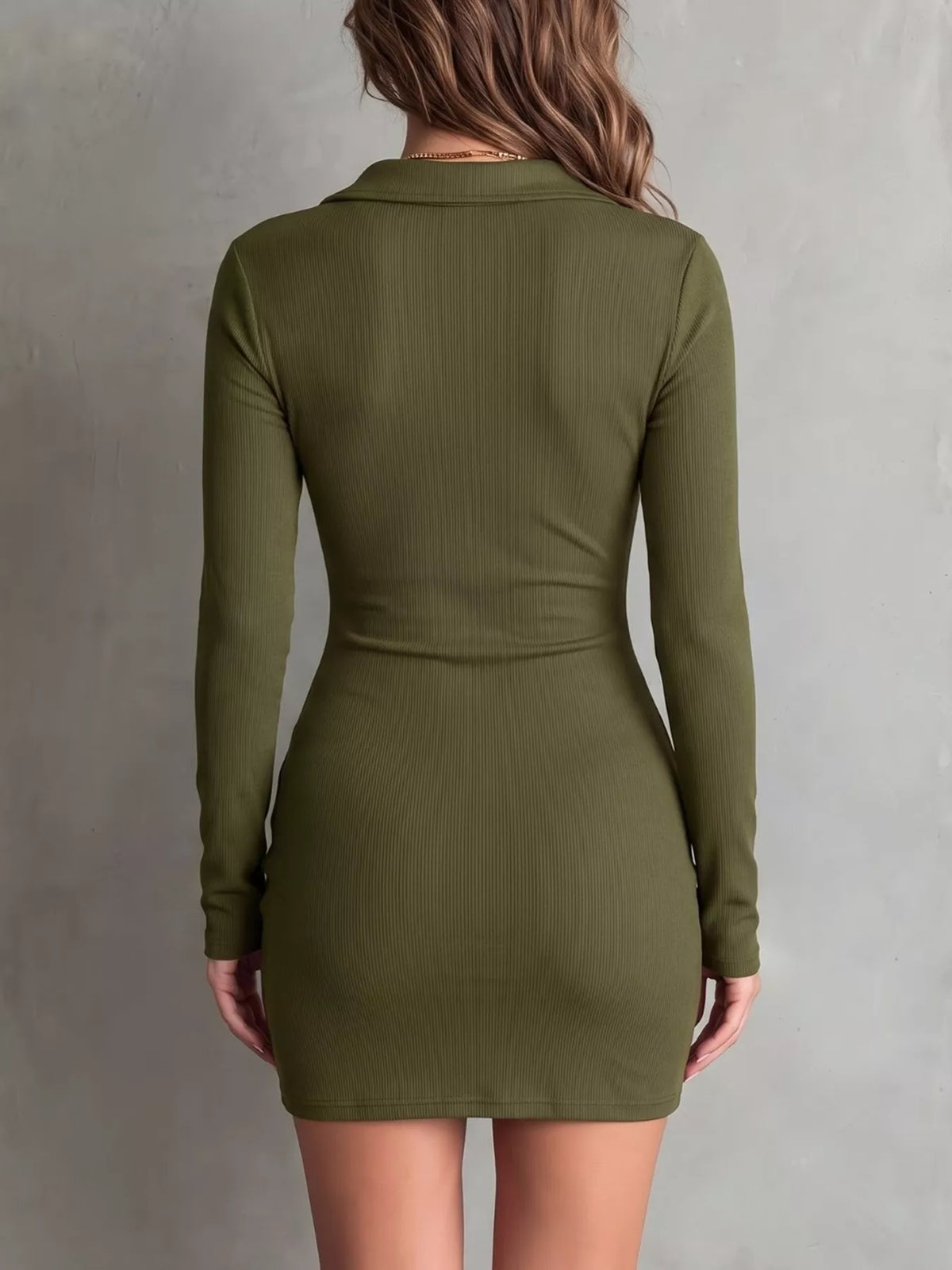 Three-quarter view of olive dress showing the button front and gathered seams.