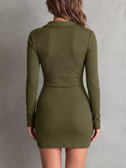 Three-quarter view of olive dress showing the button front and gathered seams.