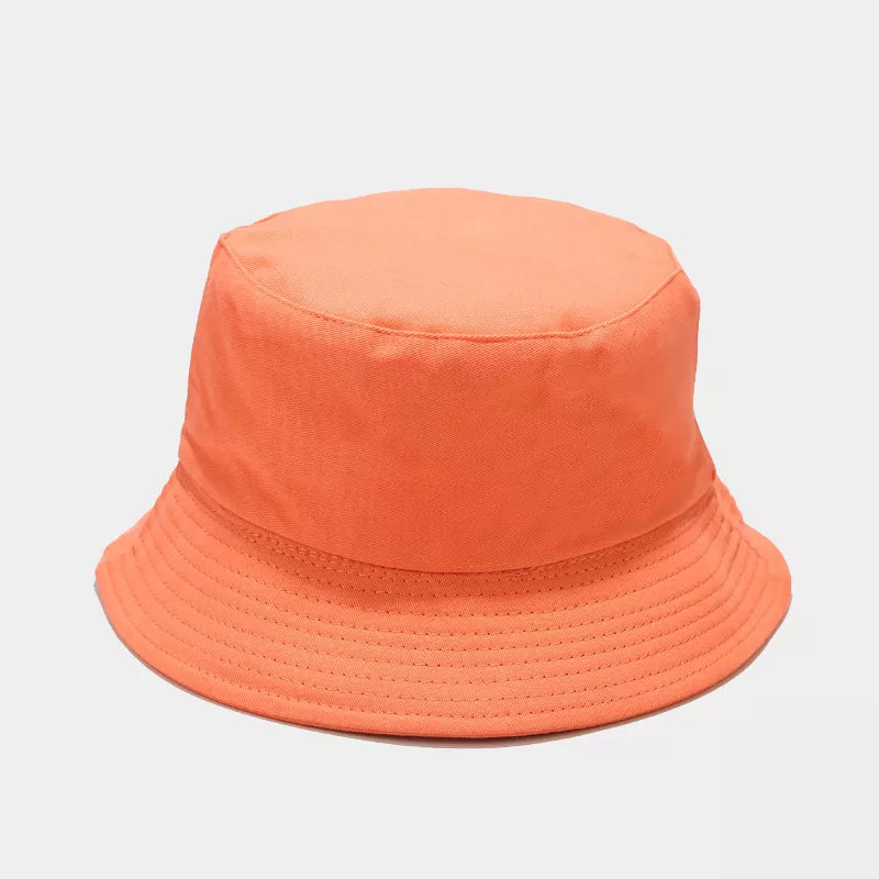 Orange solid-color bucket hat shown from the front with a stitched brim