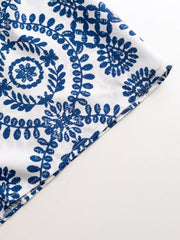 Women's printed tie-waist button-front romper, close-up of fabric pattern