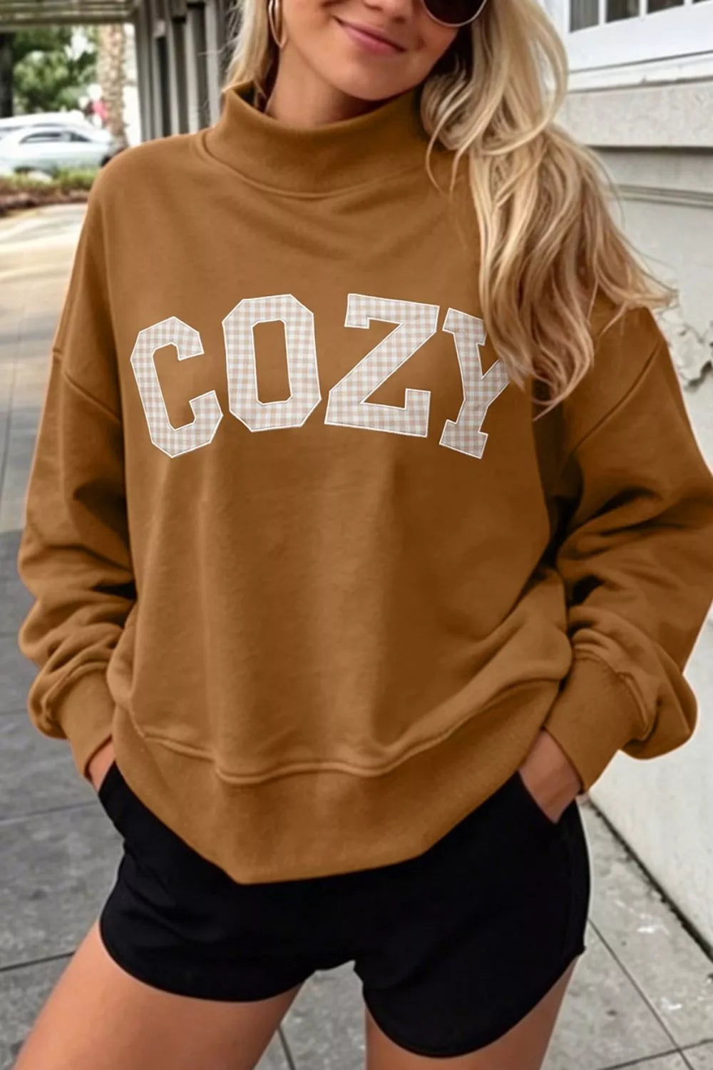 Front view of brown COZY letter mock-neck sweatshirt