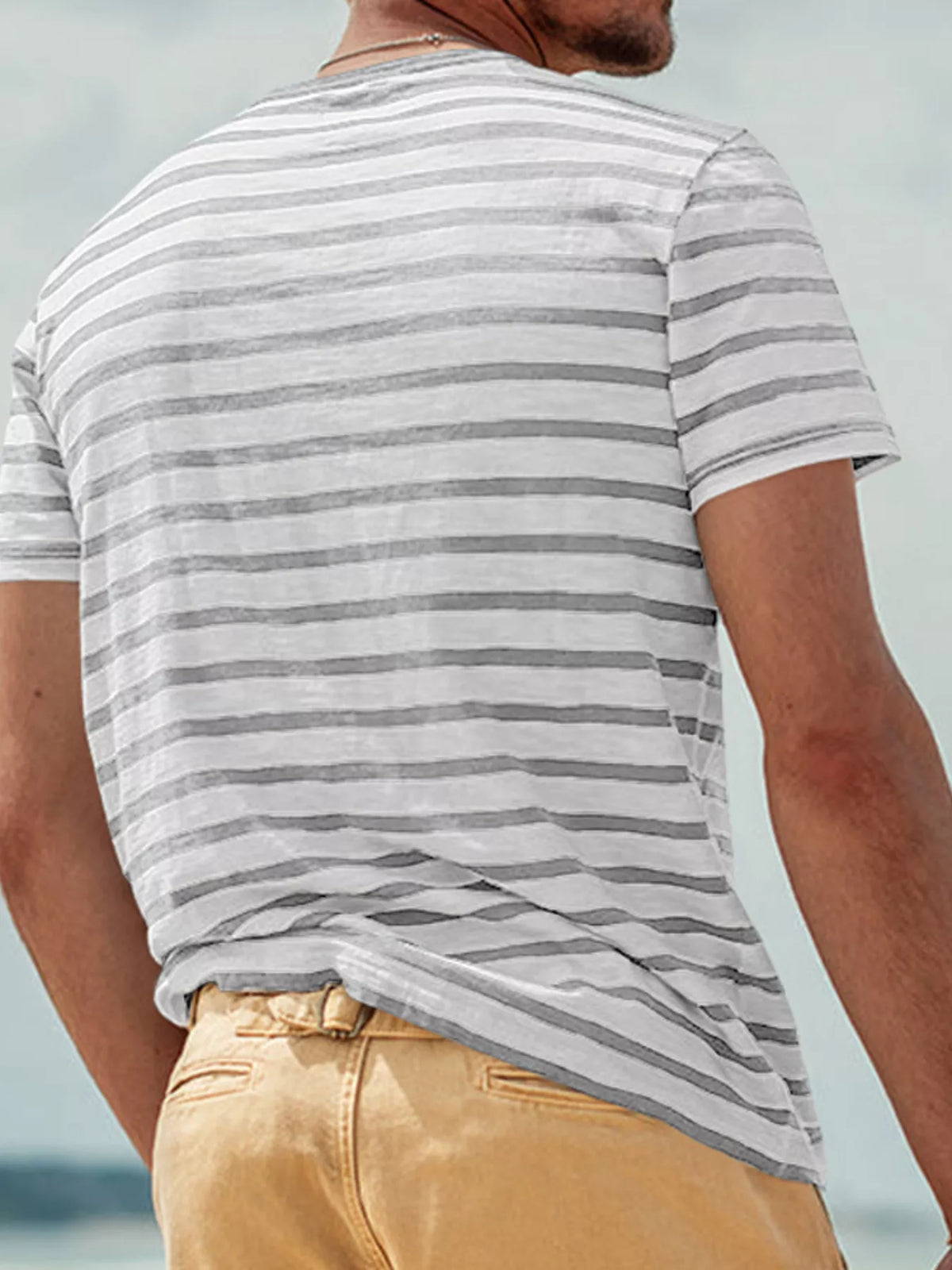 Back view of gray-and-white striped T-shirt