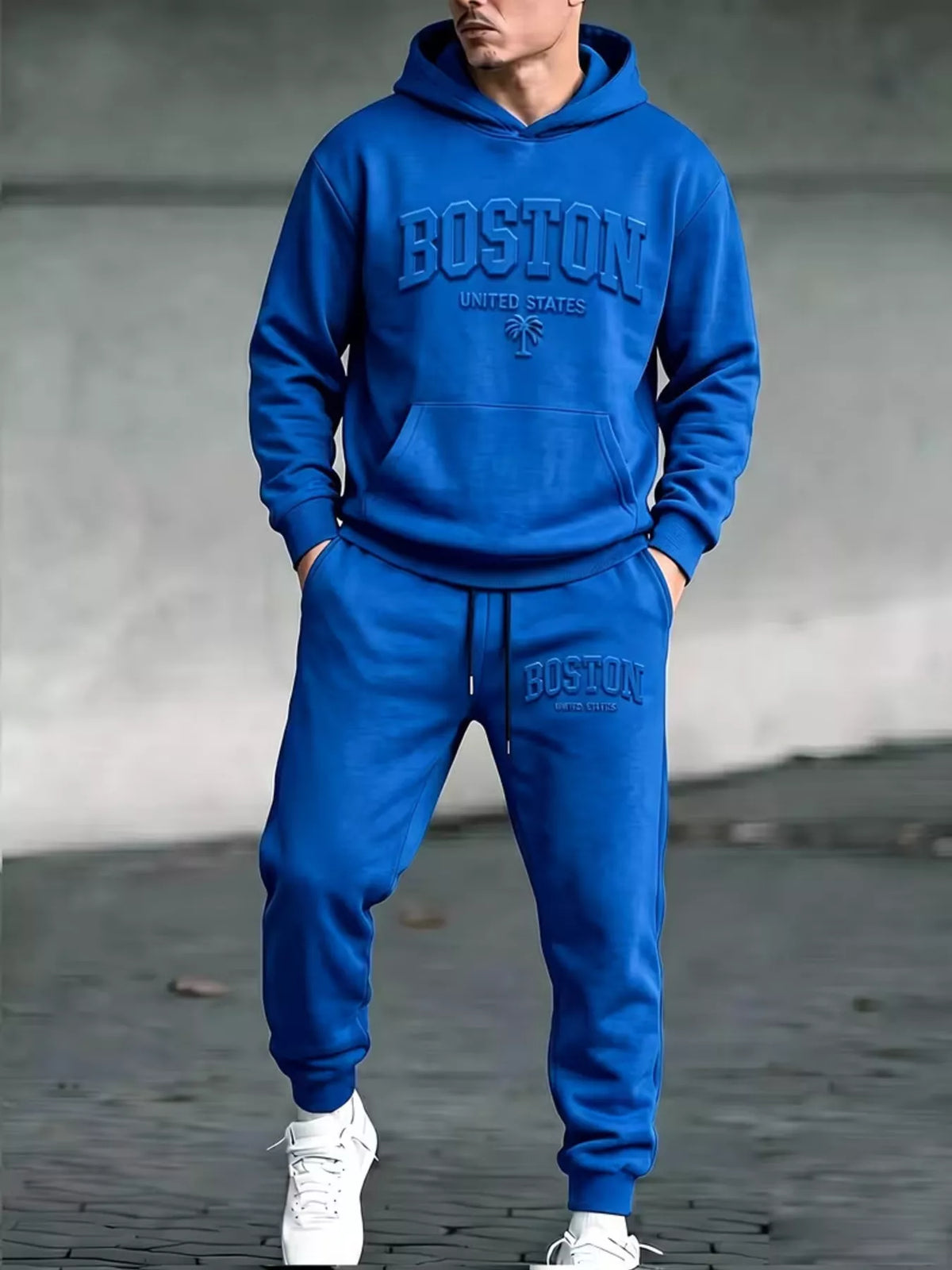 Model wearing blue Boston hoodie and matching joggers