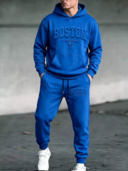 Model wearing blue Boston hoodie and matching joggers