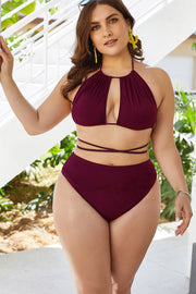 Burgundy bikini with gathered halter top and wraparound waist ties, worn beside steps